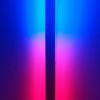 A dark line running through a blue and red light.