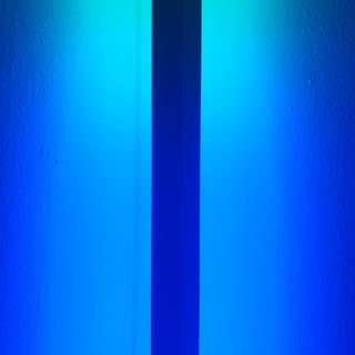 A dark line running through a blue light.