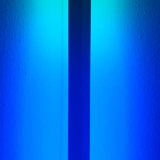 A dark line running through a blue light.